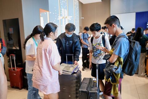Hotel check-in and study materials issued