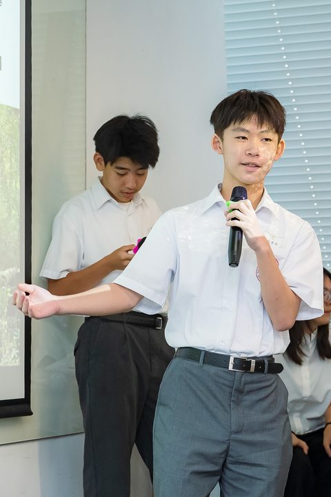 A student answers questions from the audience